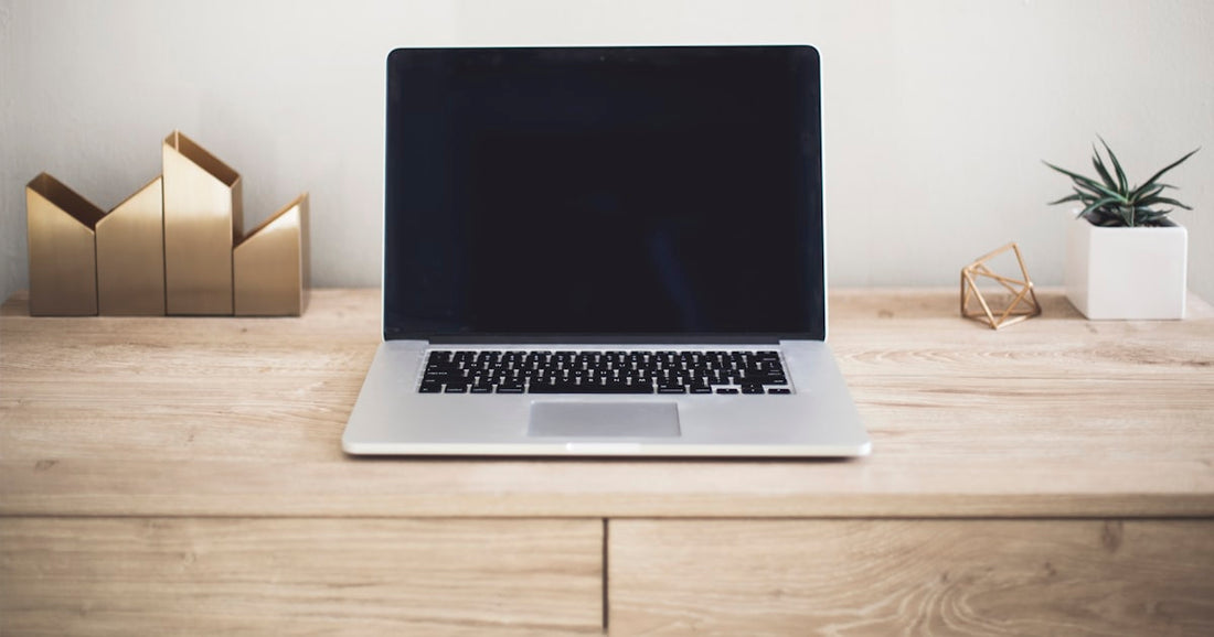 An organized small-business workspace with a spreadsheet CRM