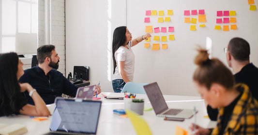 Consultant meeting a client across a table - consulting runs on memory, not pipelines