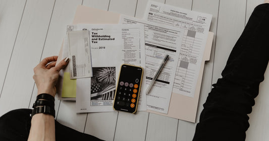 Calculator and notes on a desk - free CRM options and what free really costs