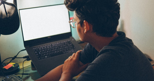 Solo business owner working at a desk on his own laptop, no cloud needed - offline CRM