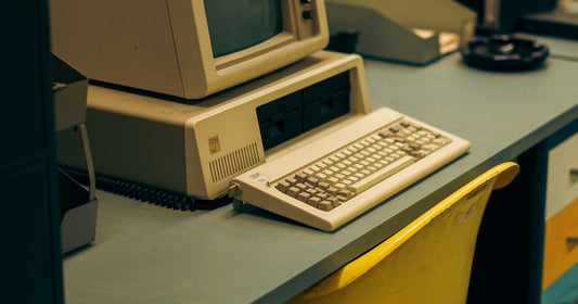 An old desktop computer on a desk - the era when you bought software once and owned it